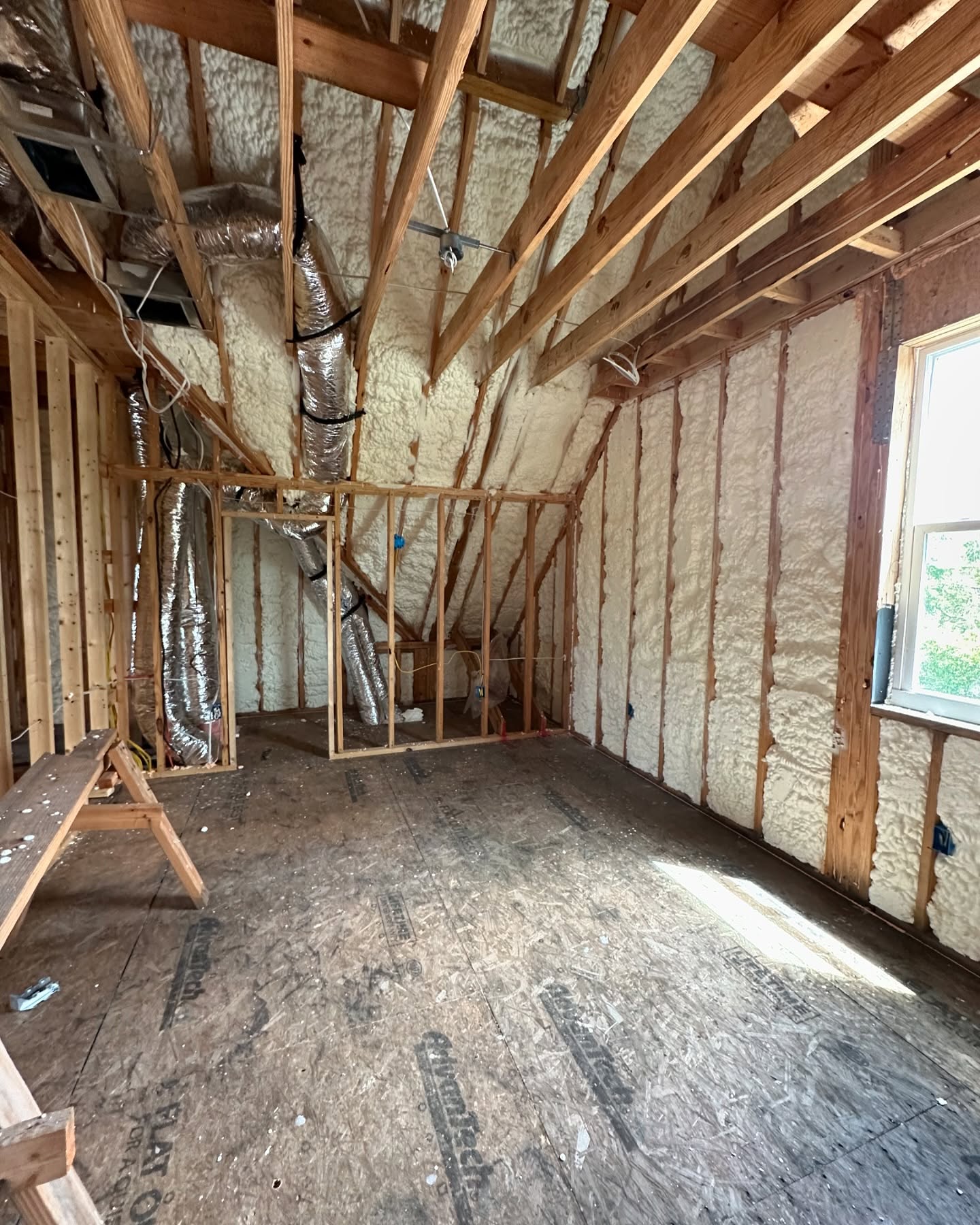Closed-cell spray foam on attic roof deck
